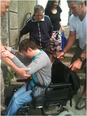 Kerry being assisted down steps in St Ives Harbour